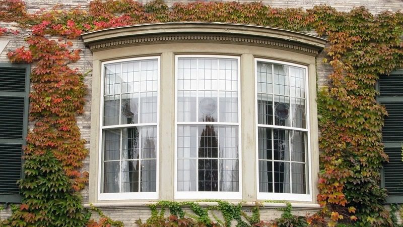 Bow window replacement on Canadian home exterior