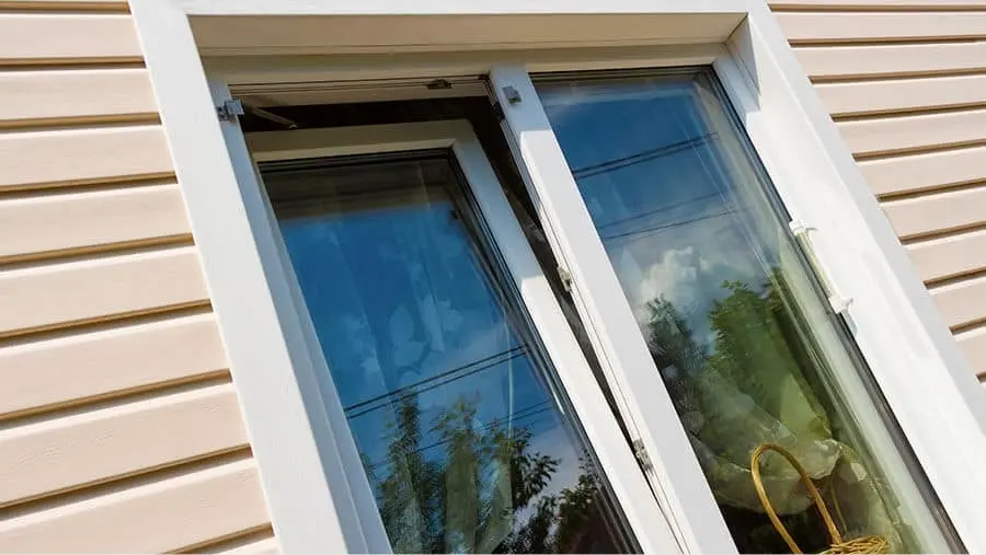 Tilt and turn window installed in Canadian home exterior